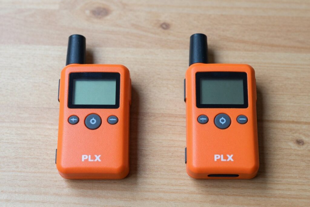 comparison showing personal locator beacon and satellite messenger side by side on table